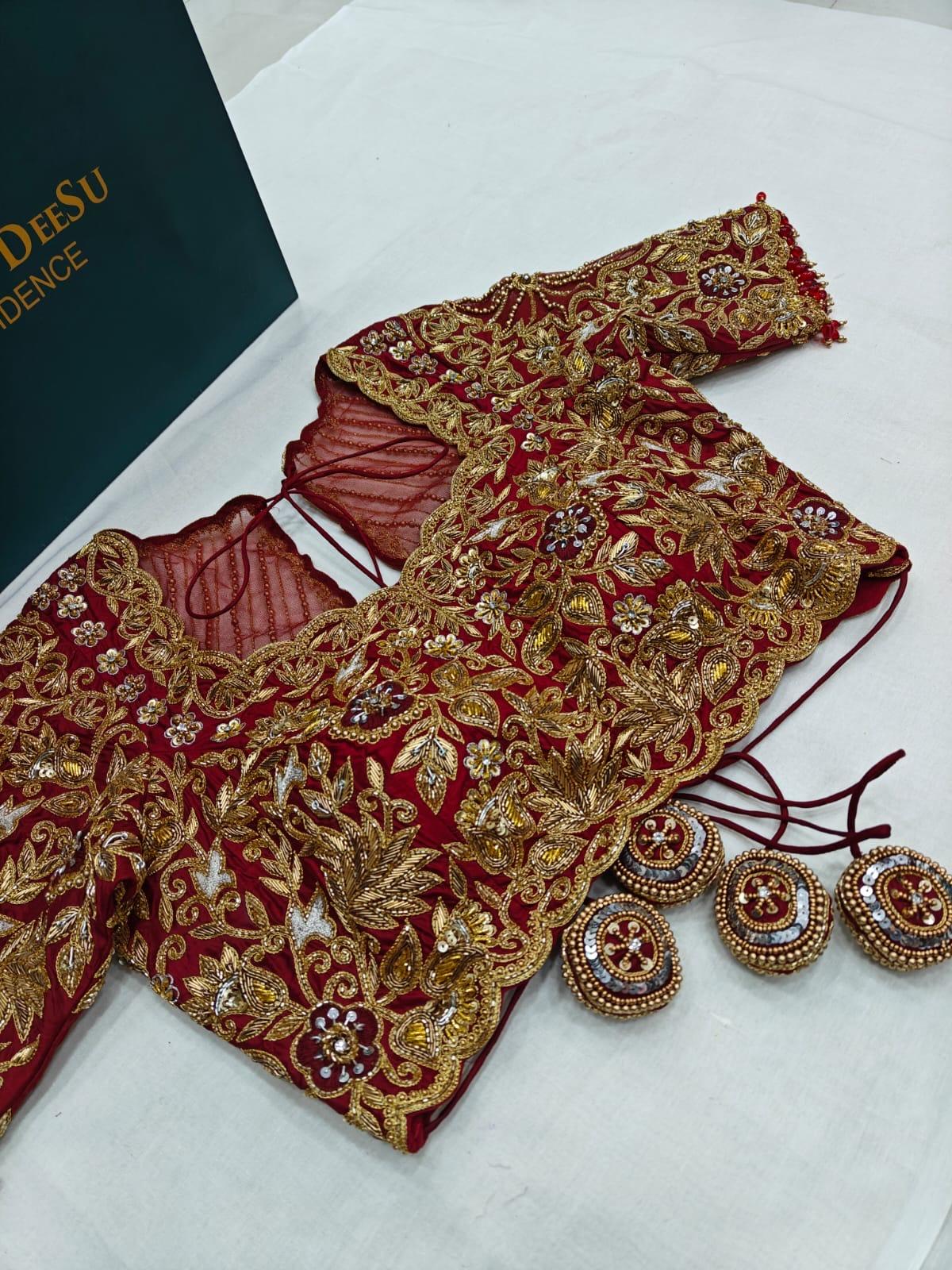 Red bridal heavy maggam work blouse with zardozi embroidery and designer tassels by Kaumesh by Deesu Hyderabad