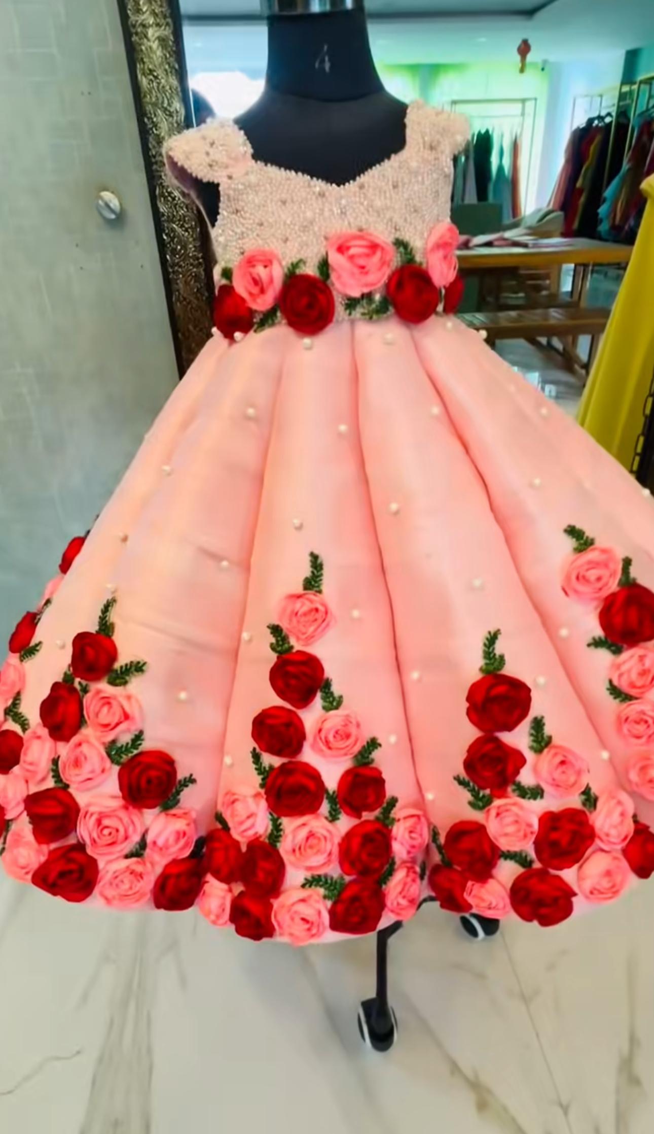 Pink ball gown with red and pink floral appliqués and pearl embellishments — Kids Birthday Party Wear Dress Design