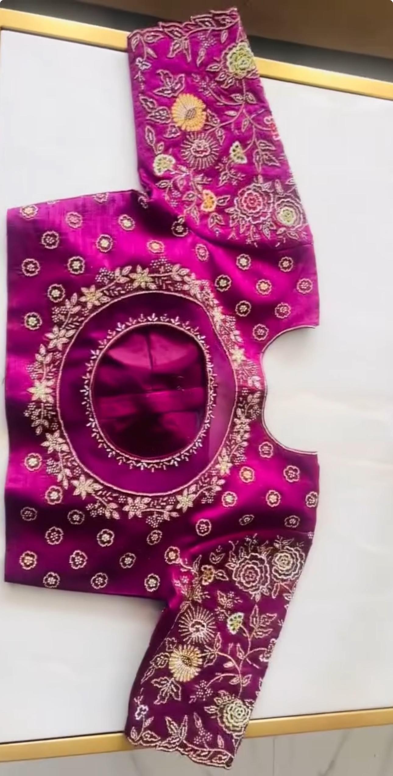 Purple bridal maggam work blouse with floral embroidery and round back neck design