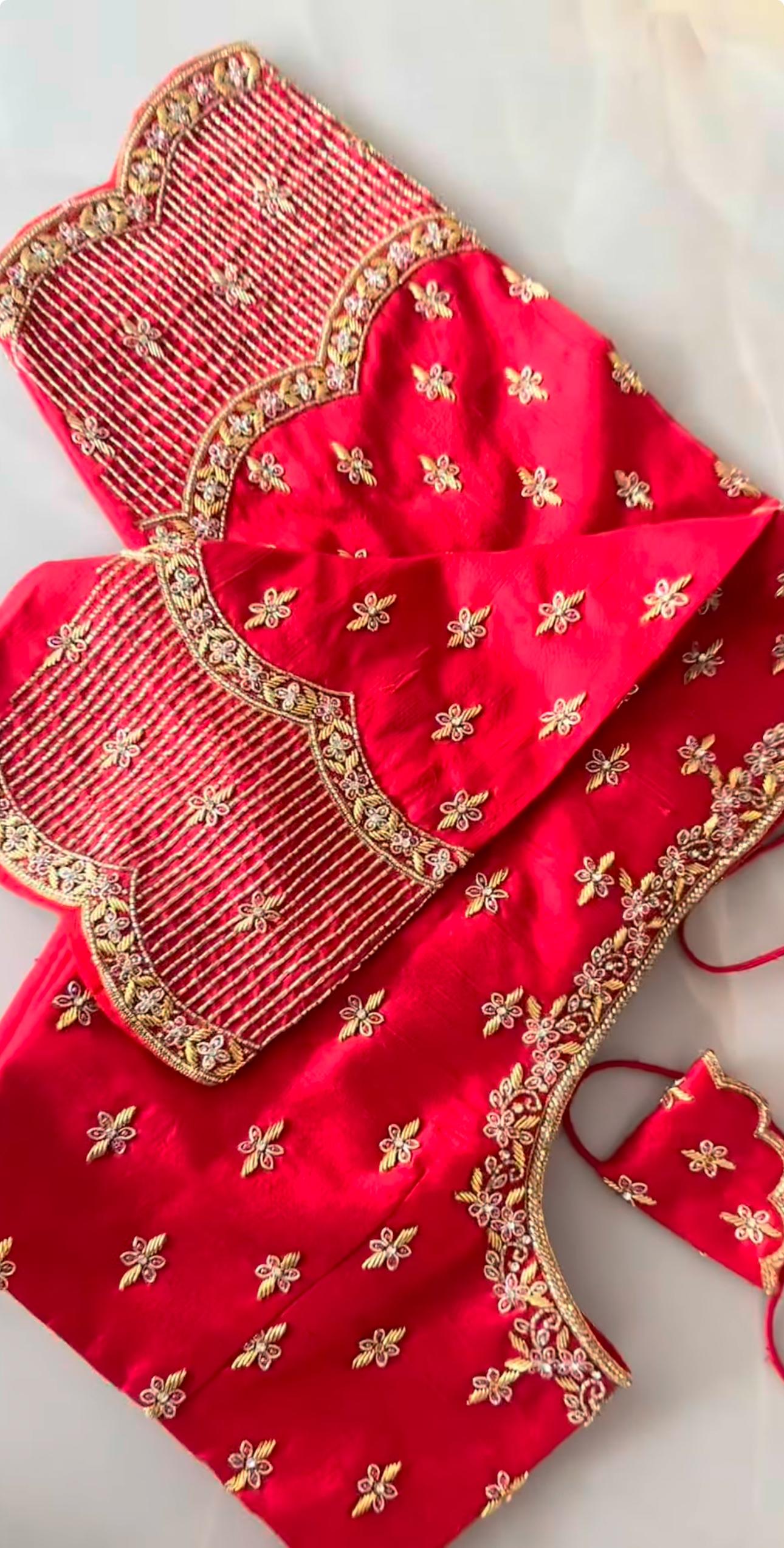 Red bridal maggam blouse with gold embroidery and elegant bridal work