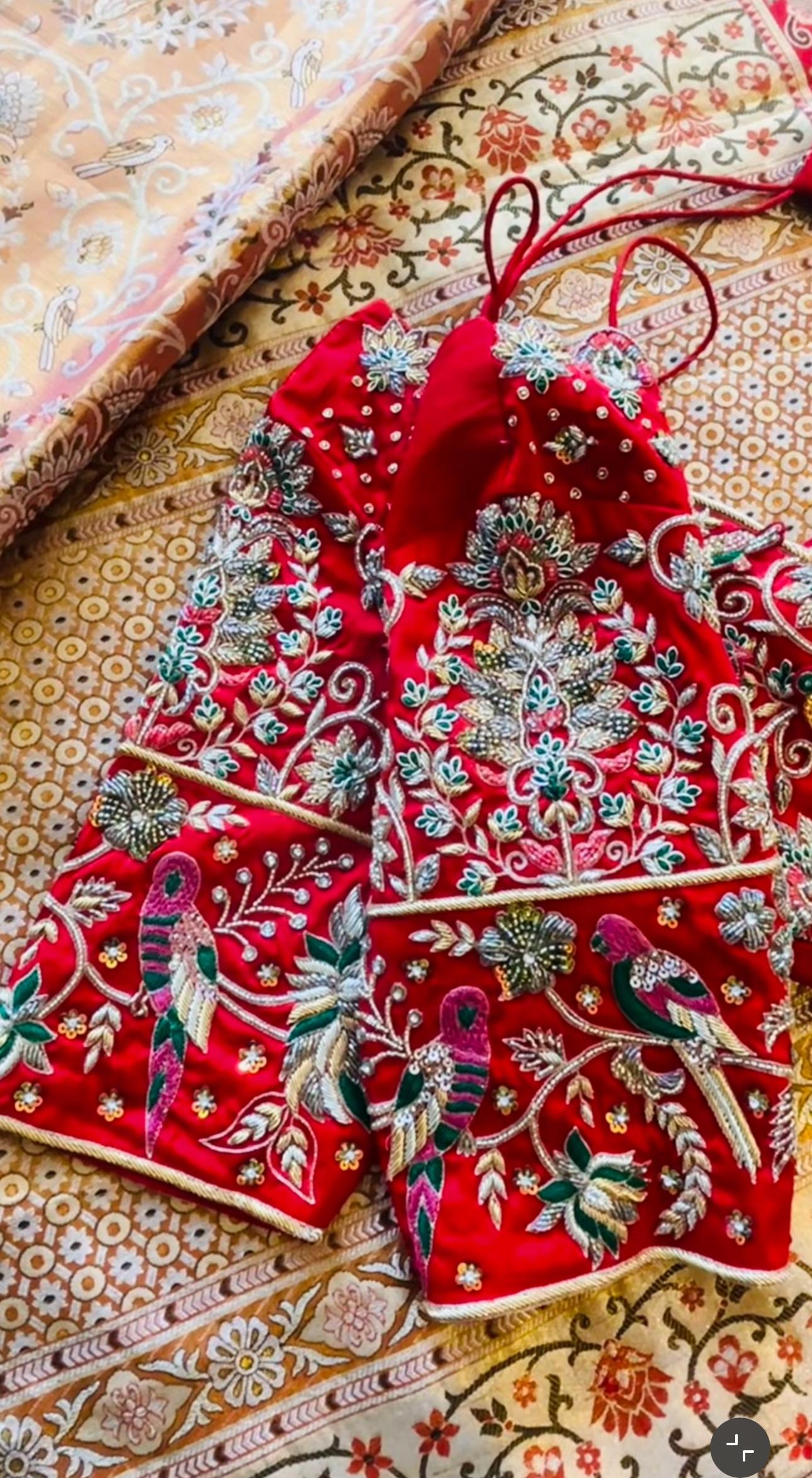 Premium red bridal maggam work blouse with bird embroidery and heavy bridal detailing