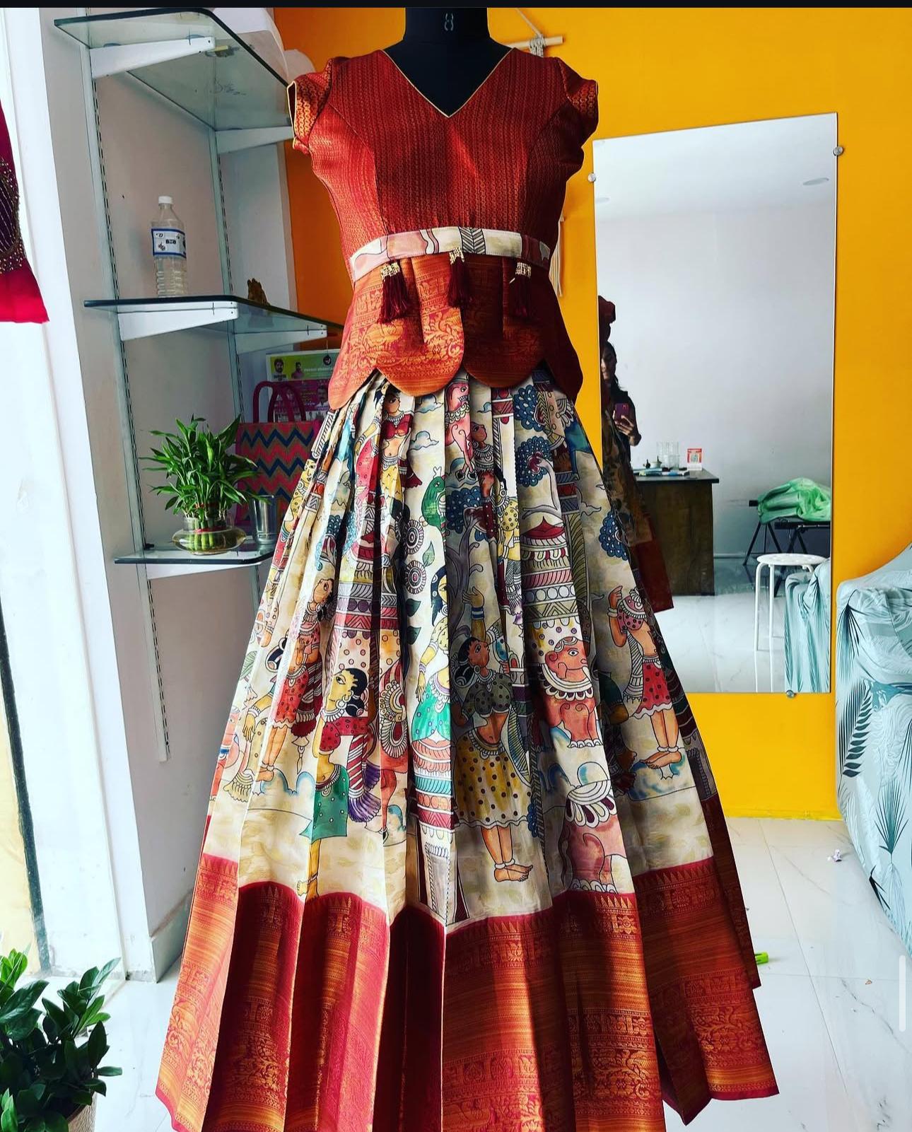 Red and Multicolor Traditional Outfit on Mannequin