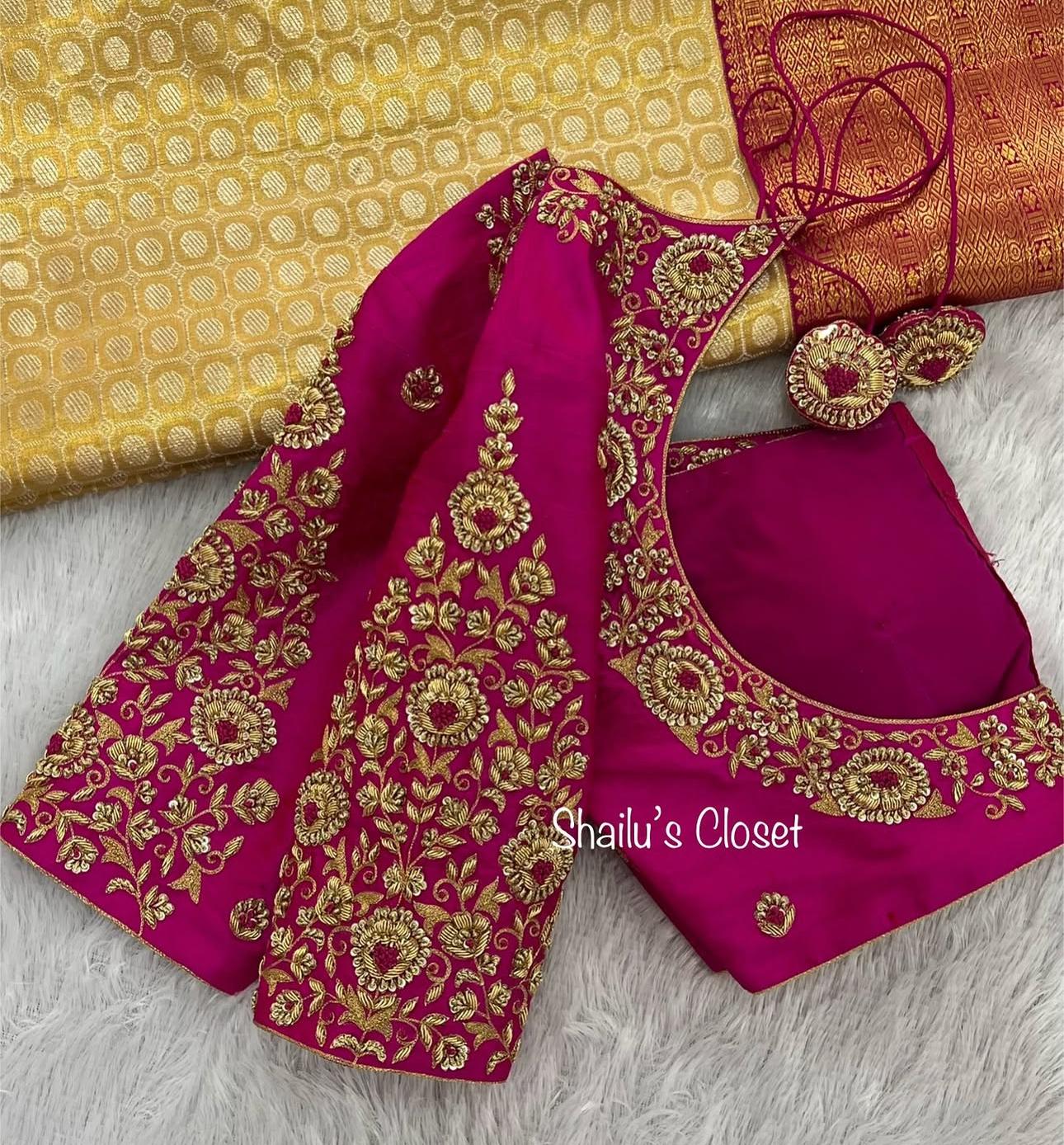 Rani pink bridal blouse adorned with rich gold maggam embroidery, designed for traditional wedding ceremonies.
