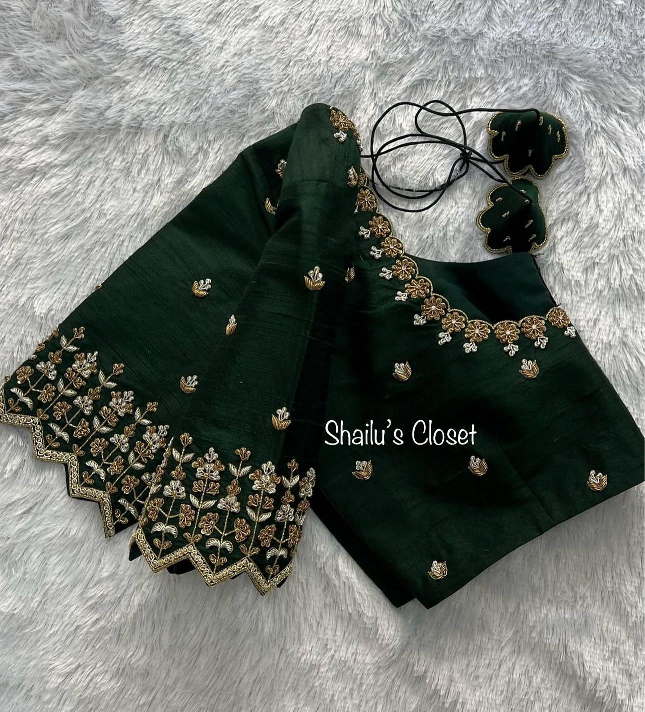 Classic dark green blouse with elegant embroidery details, suitable for festive and traditional sarees.