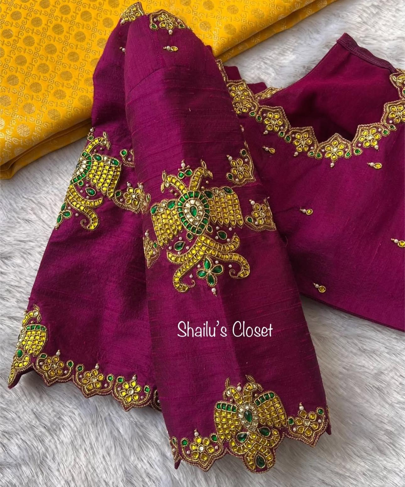 Stylish premium magenta blouse sleeve decorated with intricate maggam motif embroidery, perfect for wedding and festive sarees.