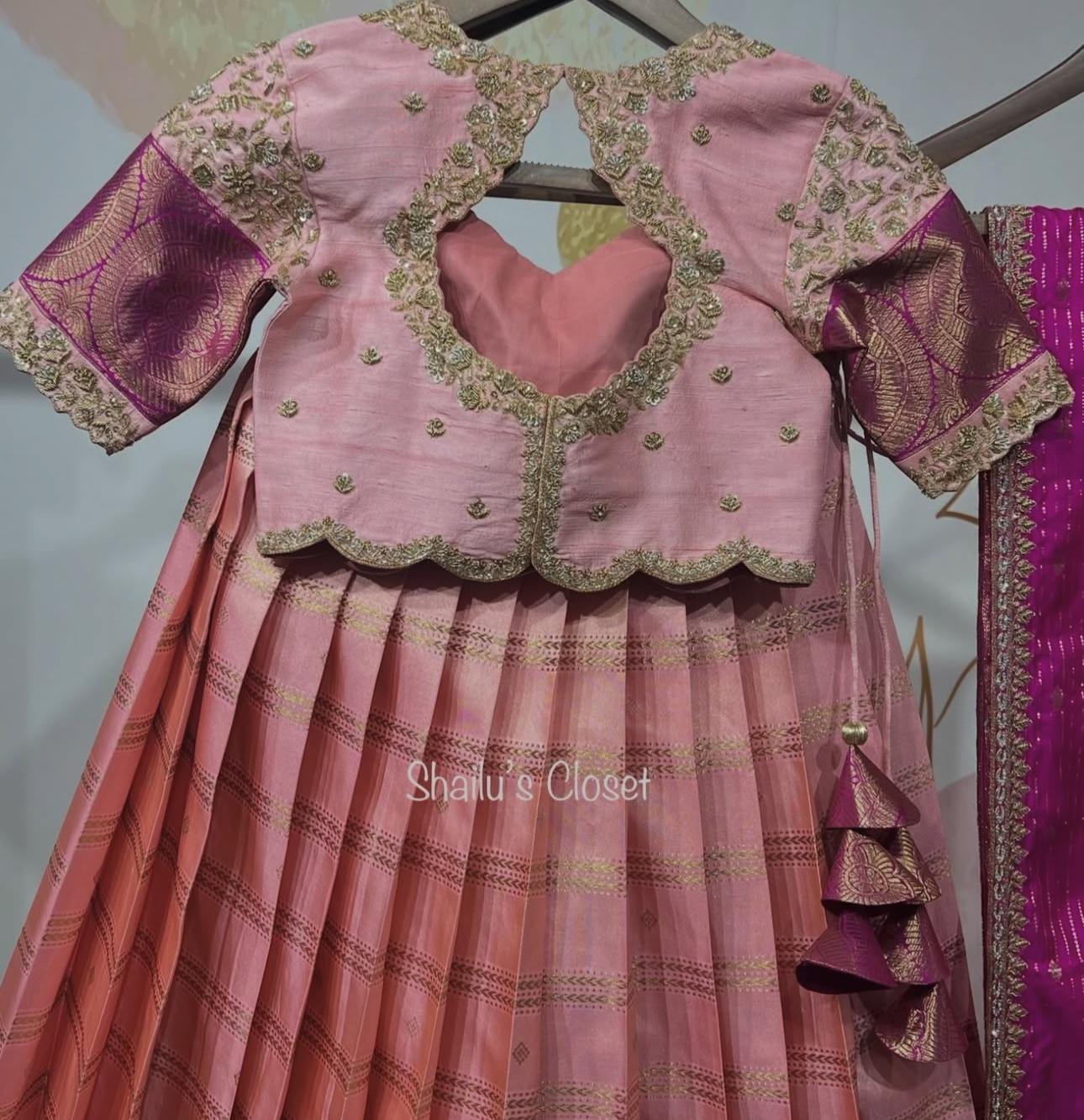 Beautiful pink designer lehenga set with embroidered blouse and detailed skirt, ideal for weddings and grand celebrations.