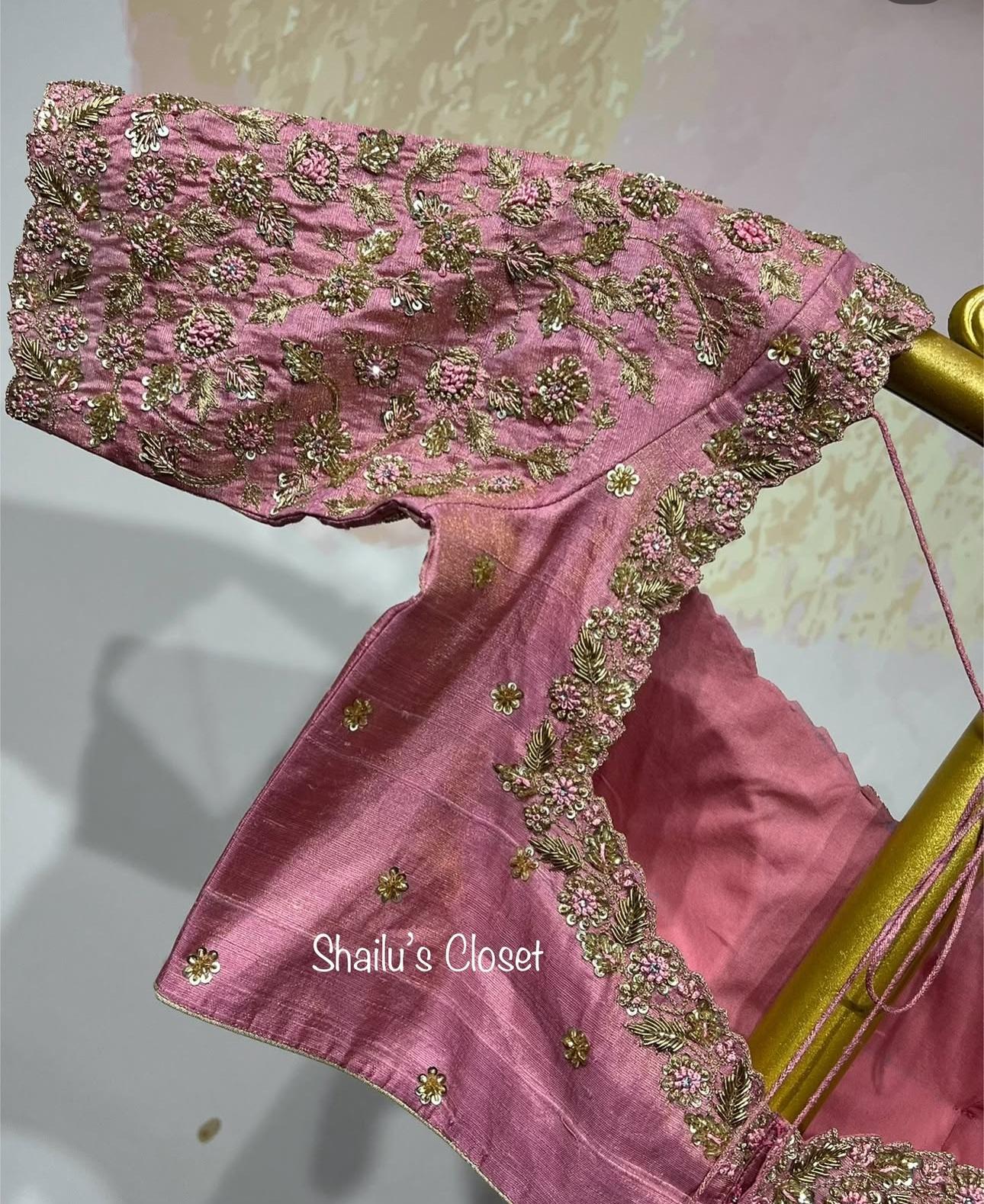 Stylish pink designer blouse with detailed floral embroidery, suitable for festive and special occasions.
