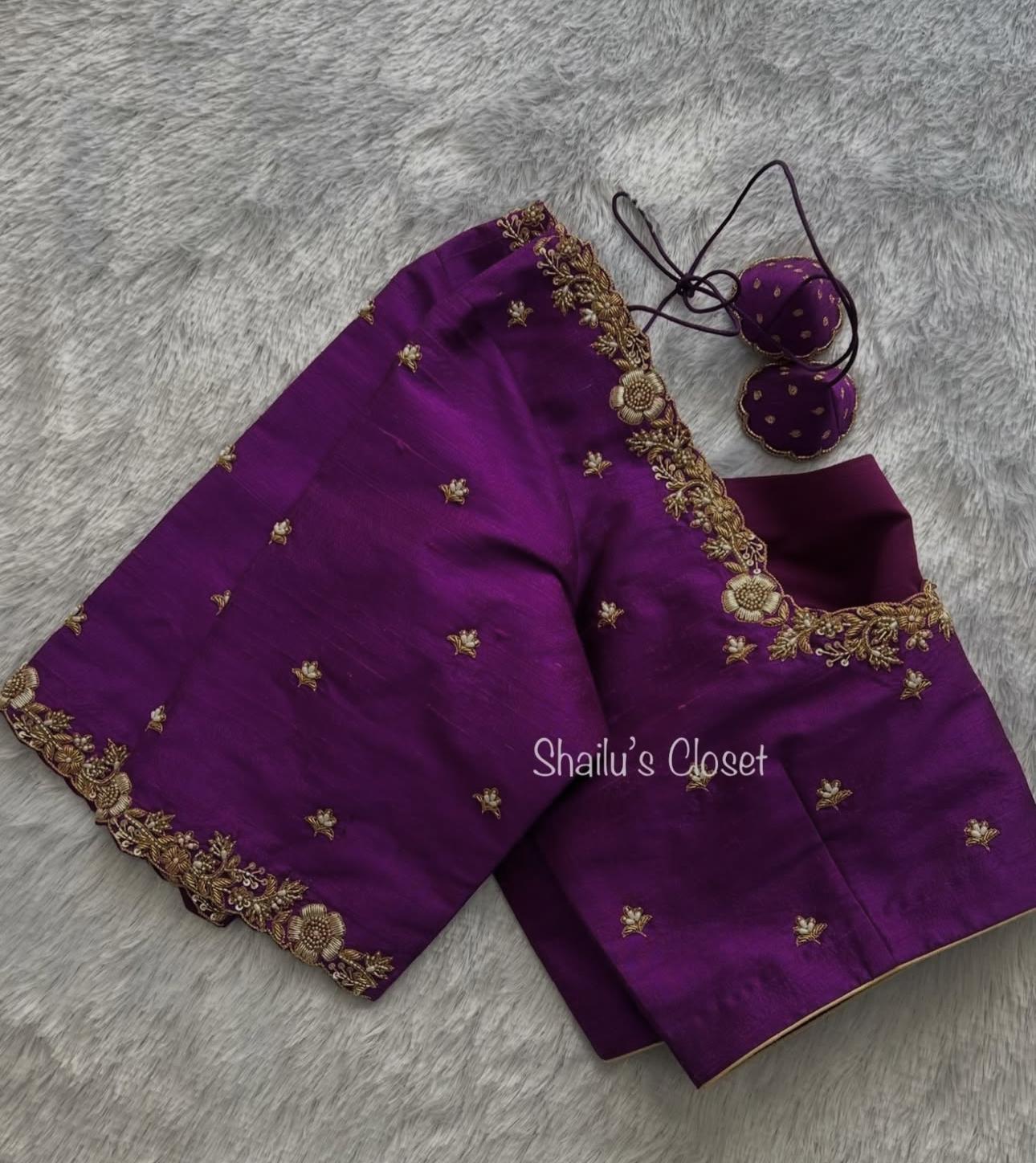 Traditional purple silk blouse with subtle detailing, ideal for classic saree combinations.