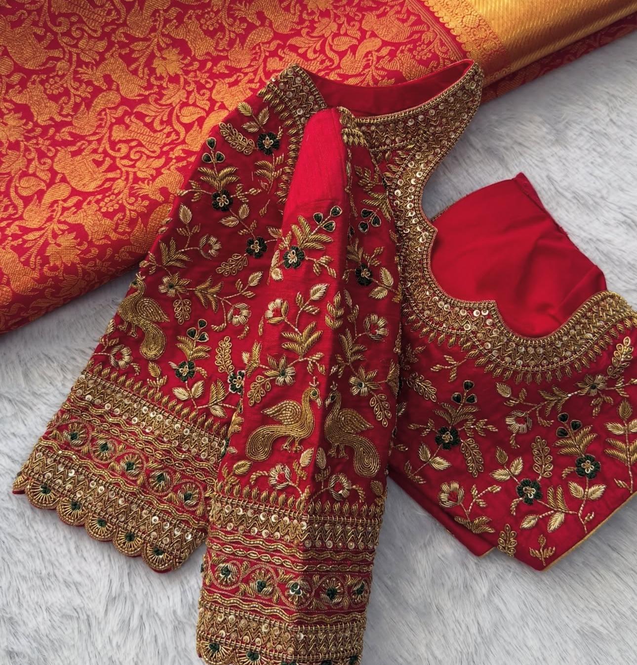 Red bridal blouse with intricate hand embroidery and designer sleeve border