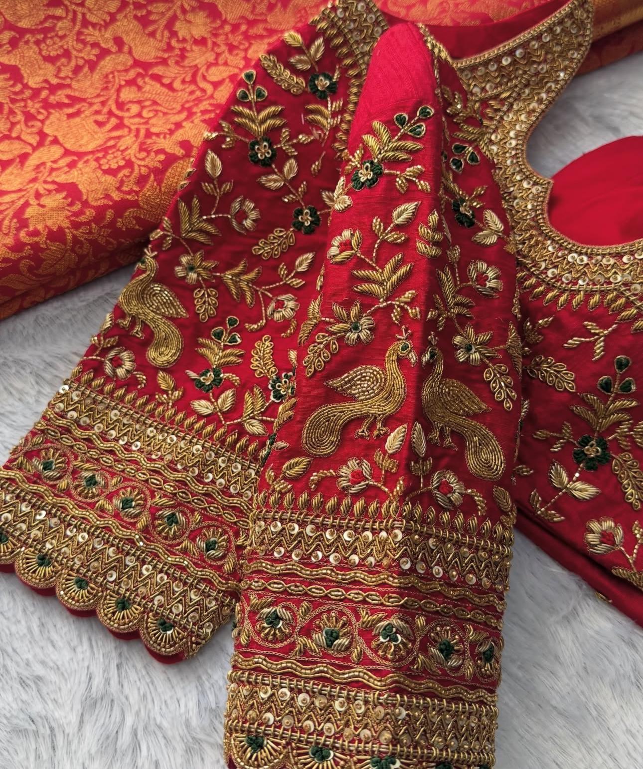 Red bridal maggam work blouse with heavy sleeve embroidery and traditional zari detailing