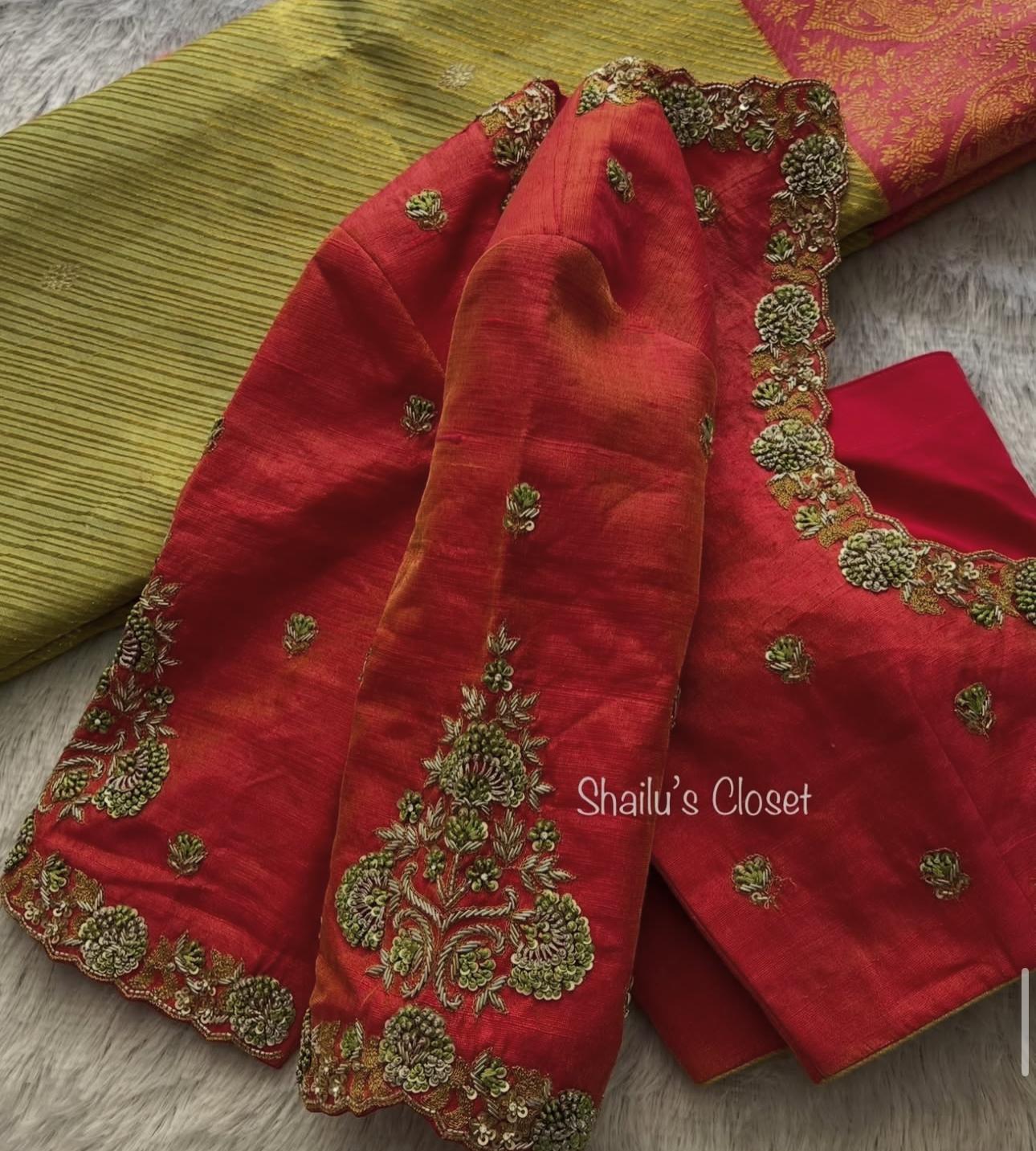 Bridal red blouse adorned with dense maggam embroidery on the sleeves, designed for grand wedding looks.