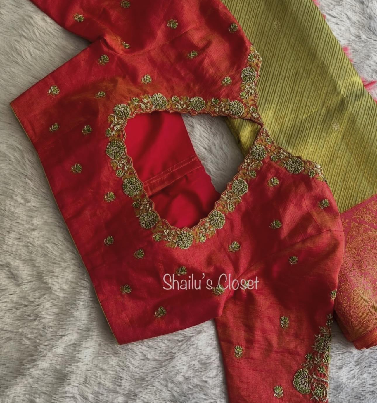 Traditional red blouse featuring elegant maggam embroidery, ideal for wedding and festive sarees.