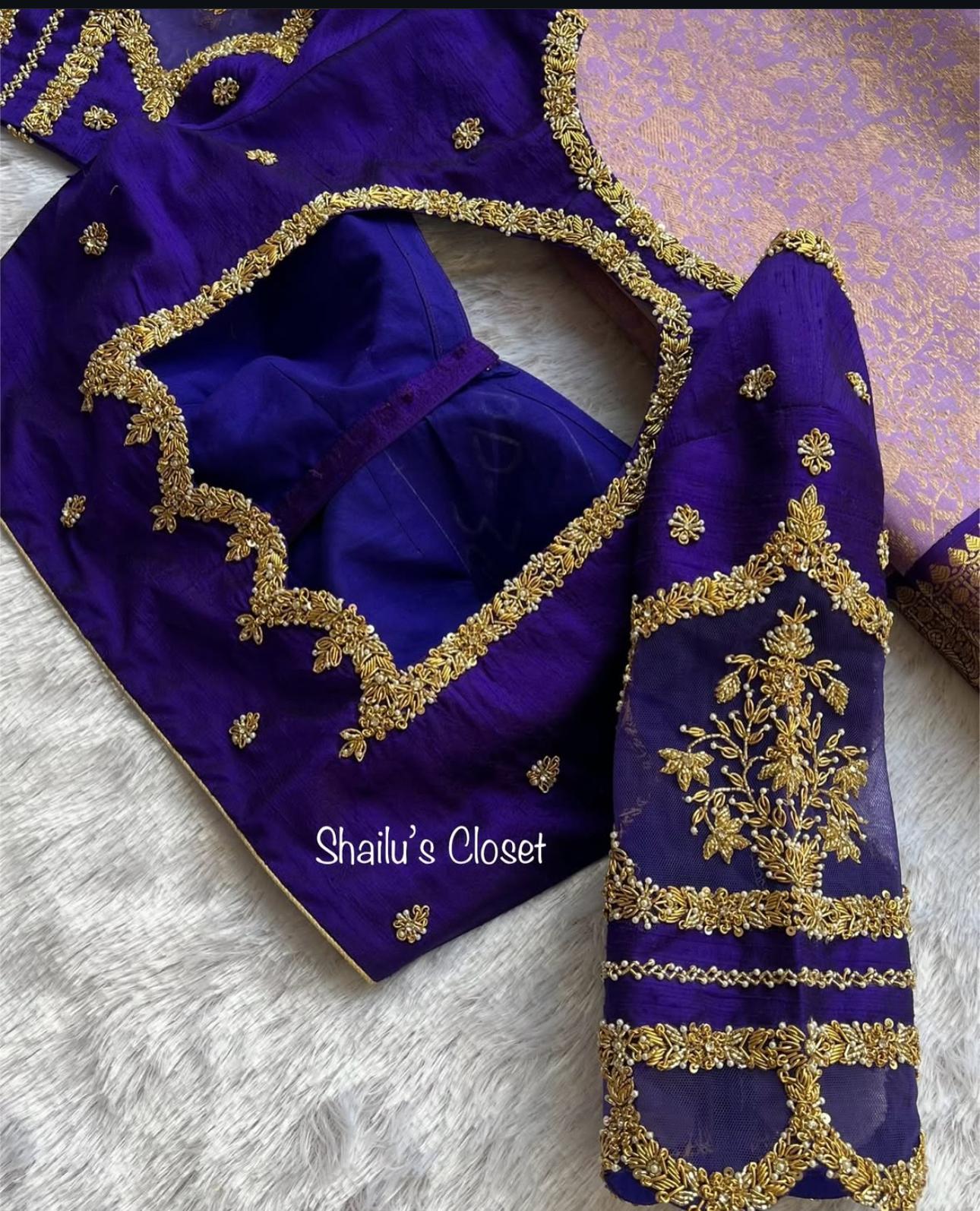 Premium royal blue blouse with elegant maggam work around the neckline and sleeves, perfect for traditional and festive occasions.