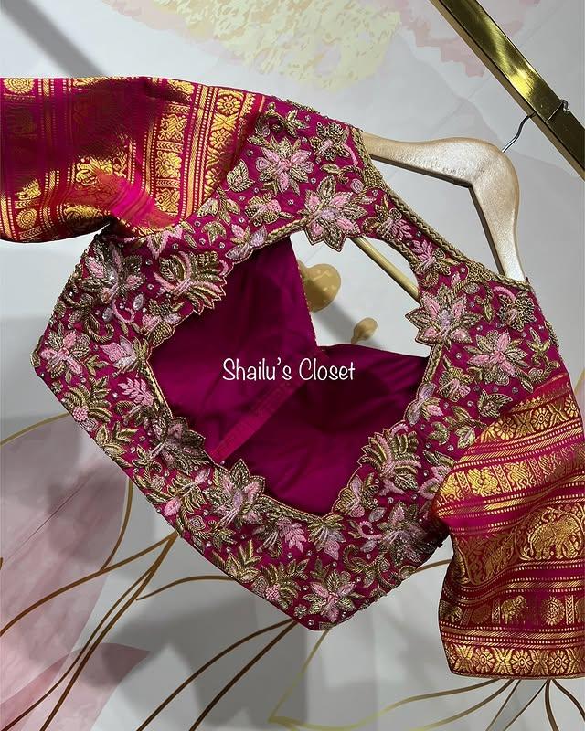 Bright pink bridal blouse featuring heavy maggam embroidery with intricate patterns, ideal for grand wedding looks.