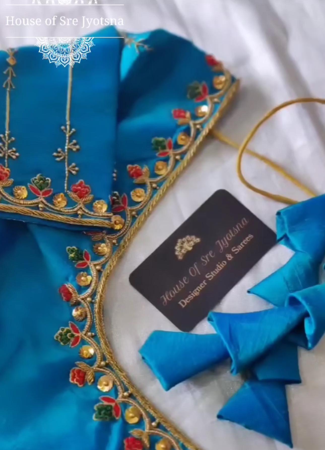 Blue blouse with floral maggam work neck design