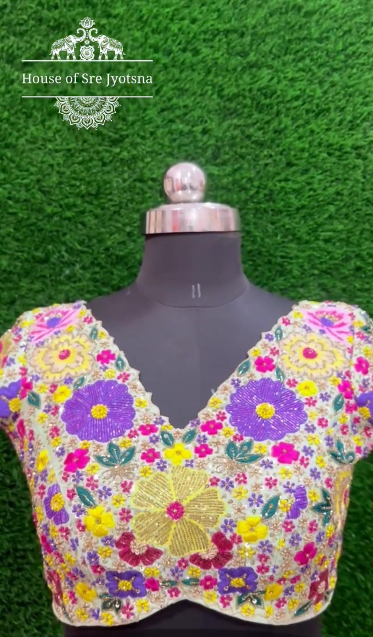 Multicolor partywear blouse with floral maggam work neck design