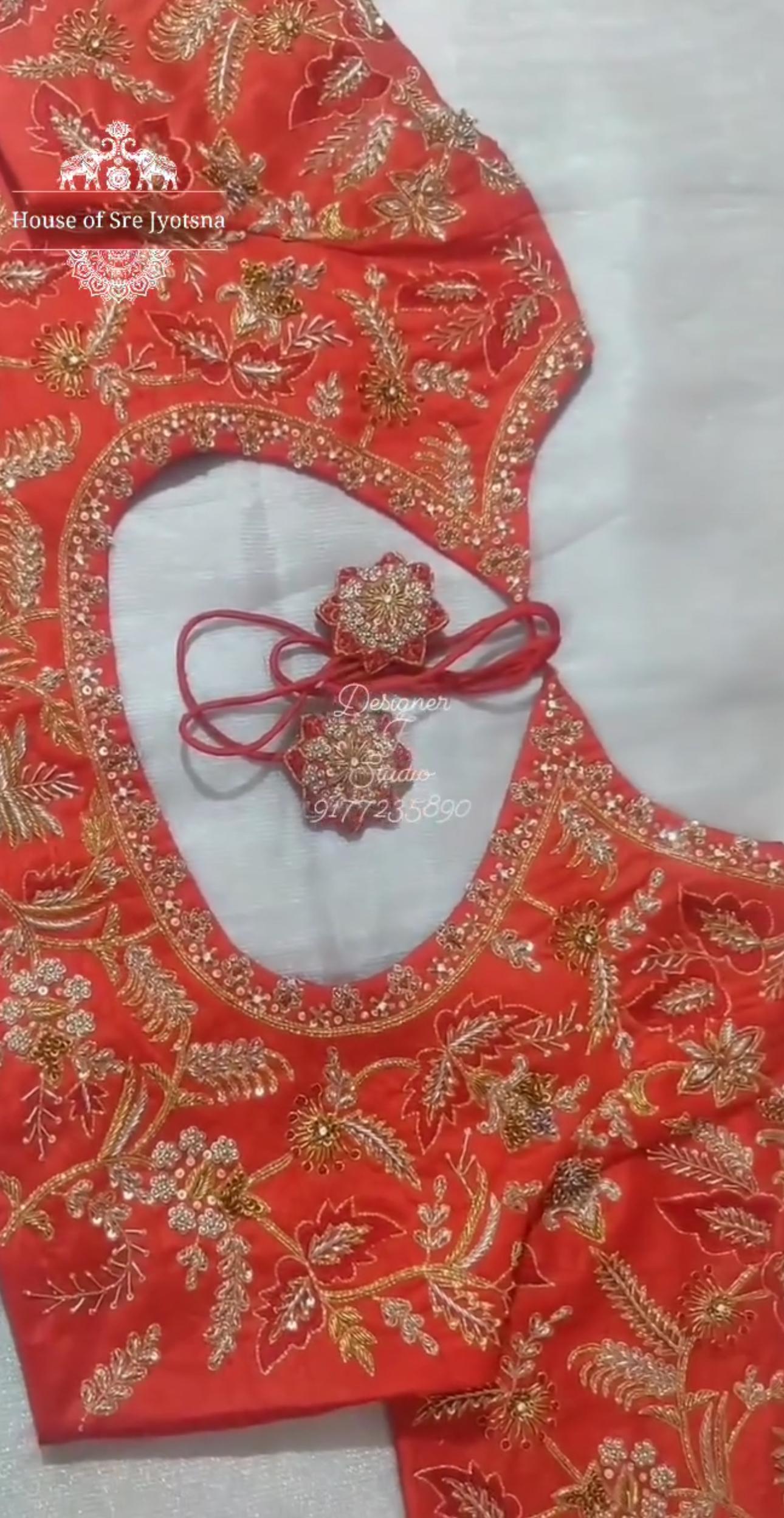 Orange bridal blouse with floral maggam work neck design