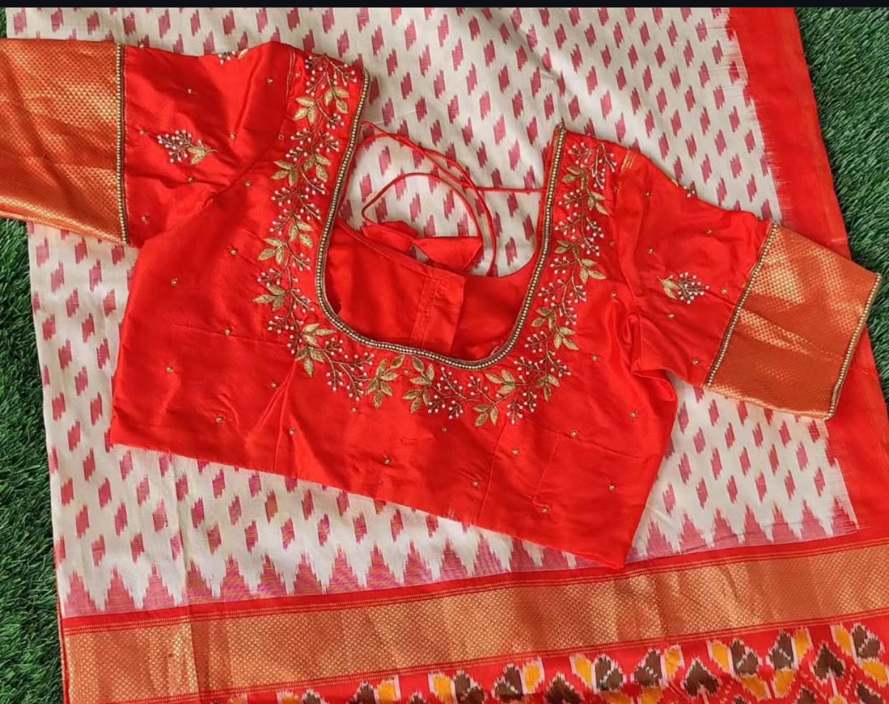 Red blouse with floral maggam work neck design