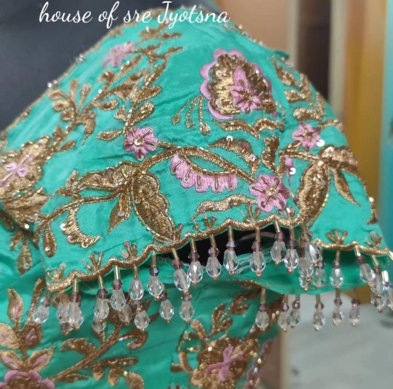 Turquoise blouse with heavy floral maggam work embroidery