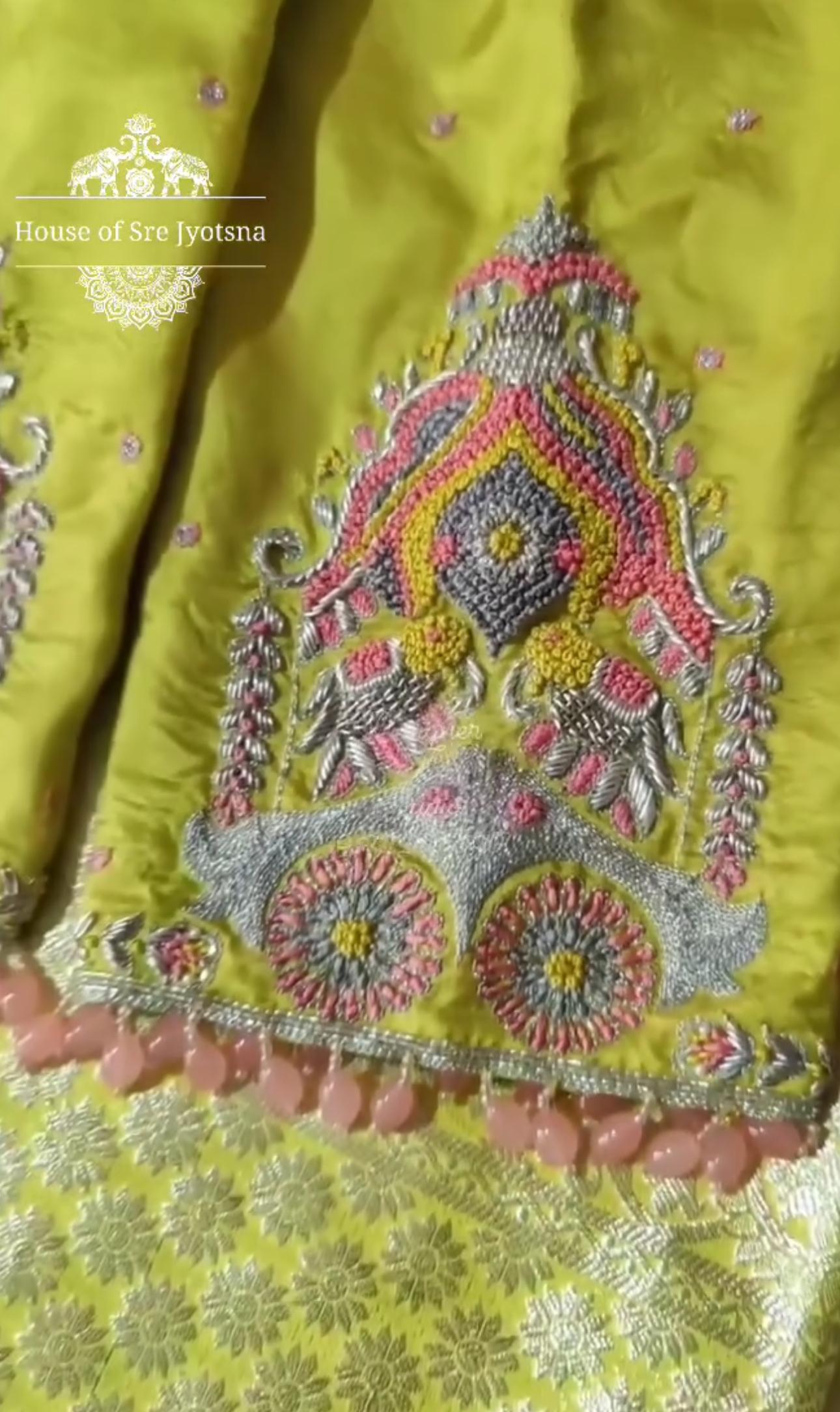 Yellow bridal blouse with heavy maggam work back design
